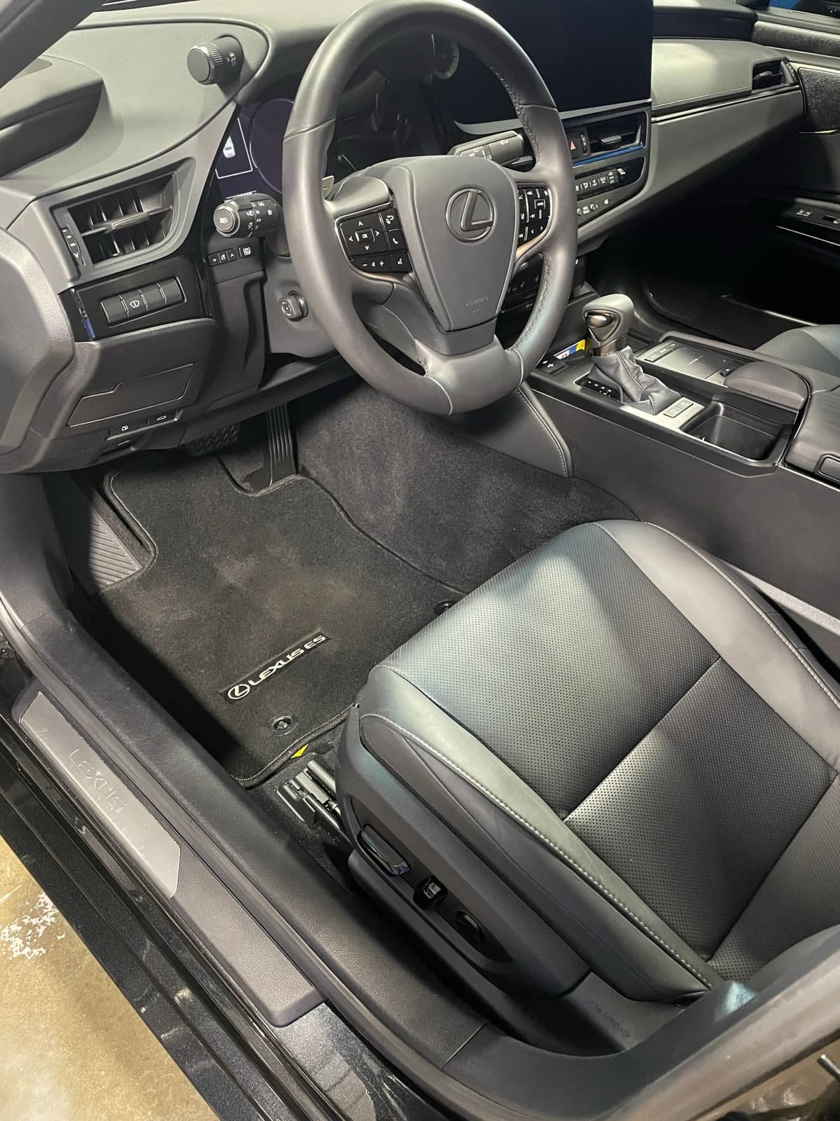 Full interior detail showing clean leather seats and dashboard
