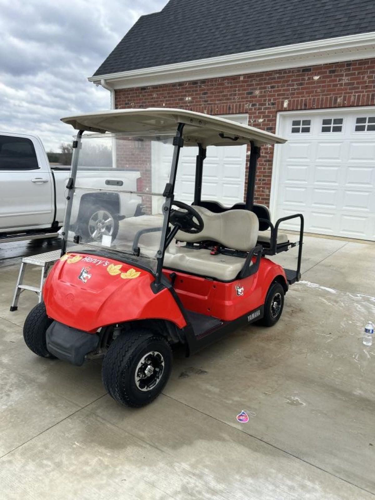 Red Yamaha golf cart detailed and cleaned