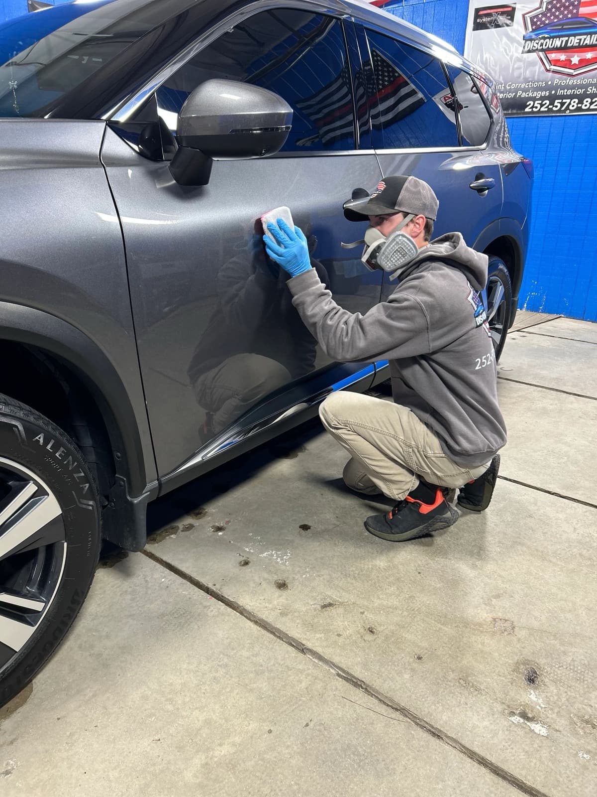 Ceramic coating applied to vehicle paint showing deep gloss and water beading